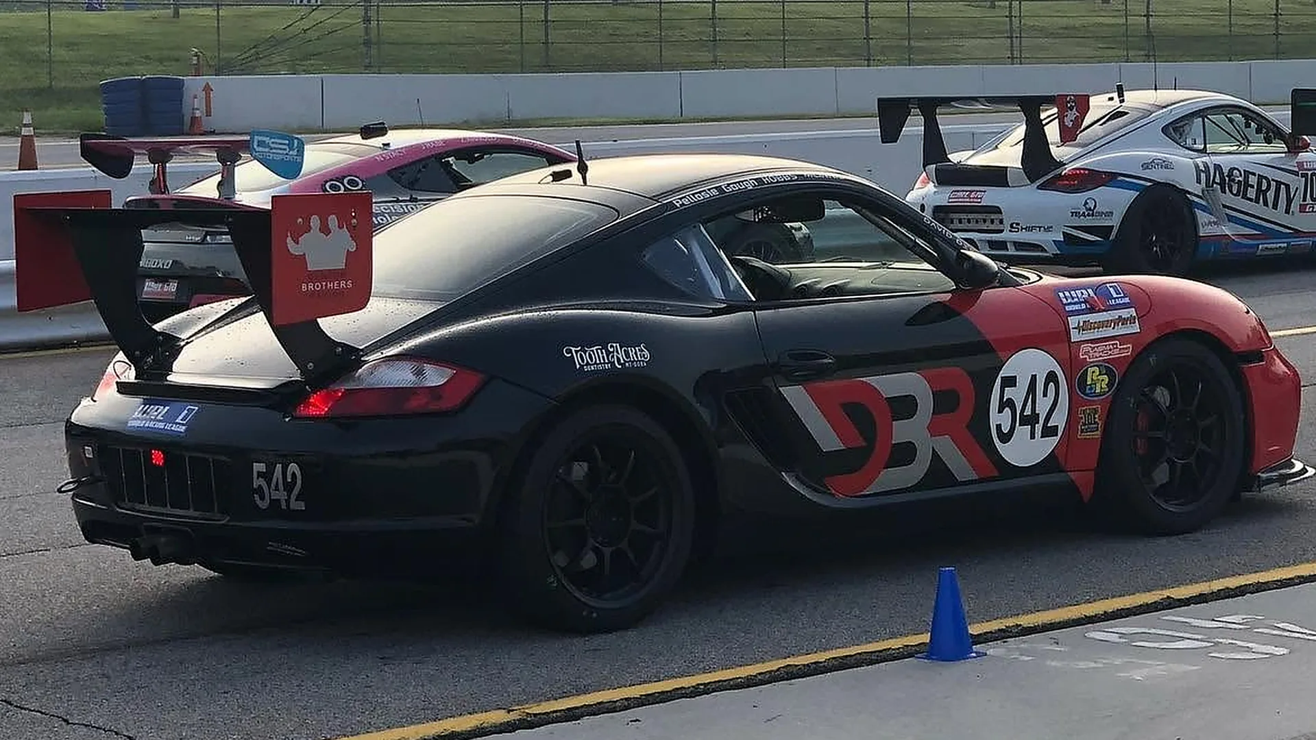 Rob's Porsche Cayman on the grid at a misty morning race start